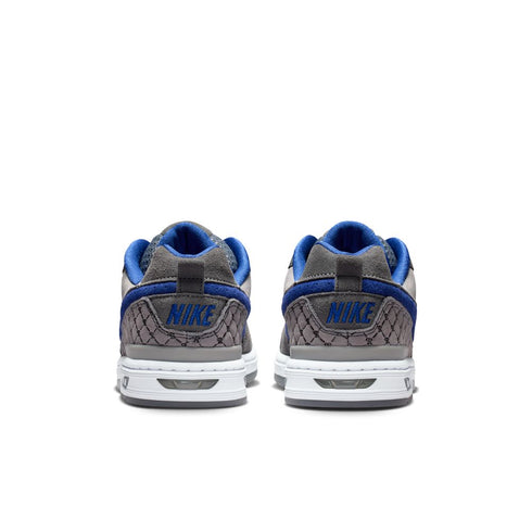 Gray and blue Nike sneakers on a white background