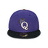 Purple and black baseball cap with a letter Q with crown logo on a white background