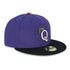 Purple and black baseball cap with a letter Q with crown logo on a white background
